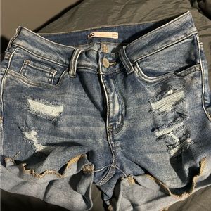 ripped blue jean shorts